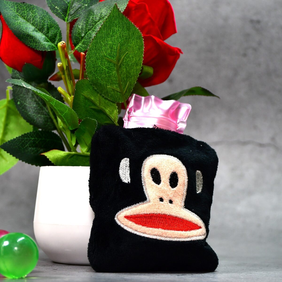 Black Monkey Small Hot Water Bag with Cover for Pain Relief - Image 1